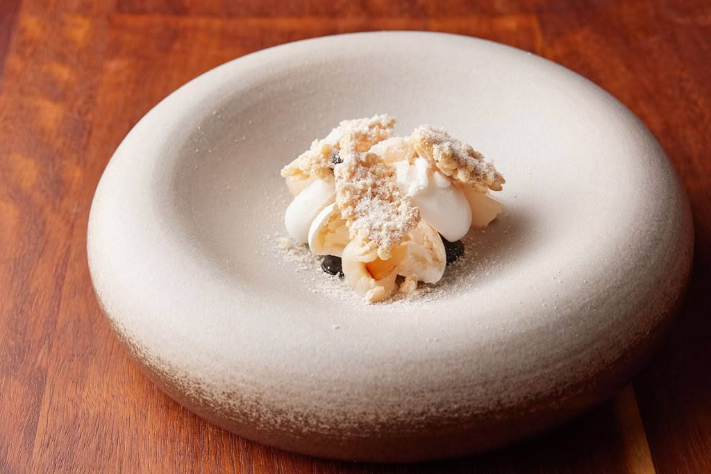 Cuisine-Good-Food-Guide-2024-Sid-at-The-French-Cafe-Coconut,-lychee,-licorice,-pavlova,-puffed-rice-credit-Josh-Griggs