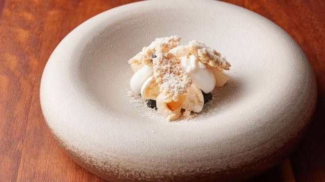Cuisine-Good-Food-Guide-2024-Sid-at-The-French-Cafe-Coconut,-lychee,-licorice,-pavlova,-puffed-rice-credit-Josh-Griggs