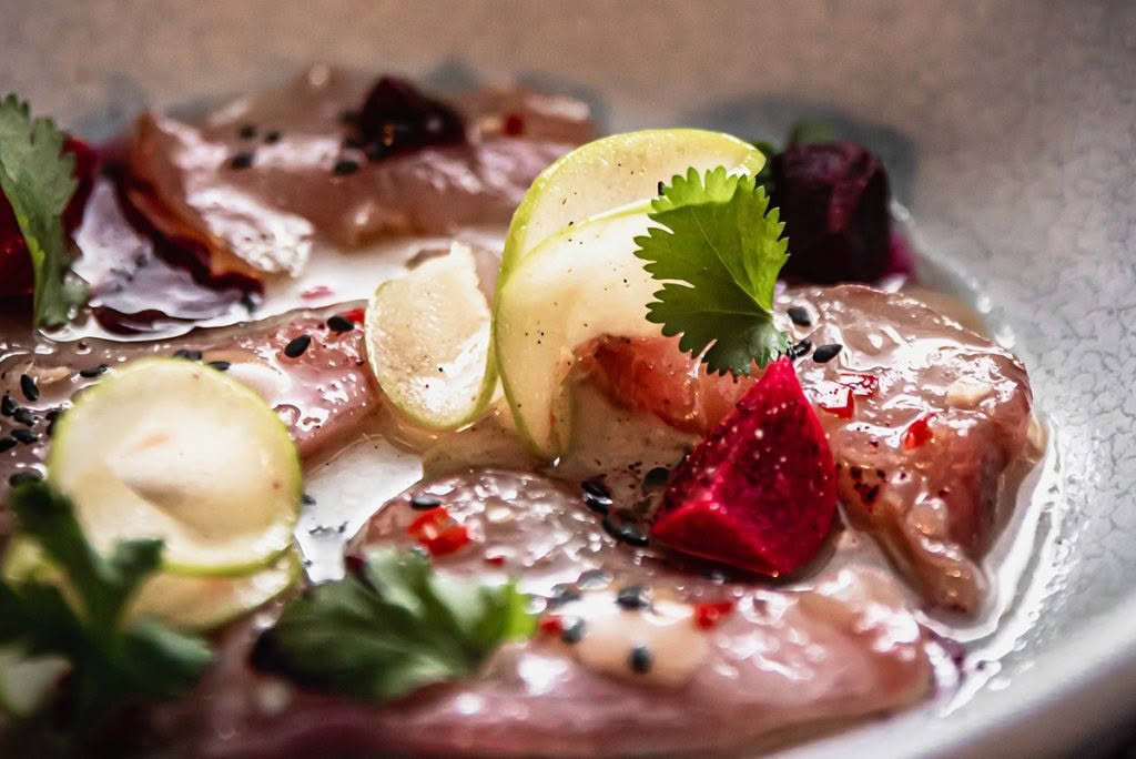 Cuisine-Good-Food-Guide-2024-The-Bistro-Dry-age-raw-Hapuka,-sichuan-pickled-green-apple,-smoked-kina-emulsion