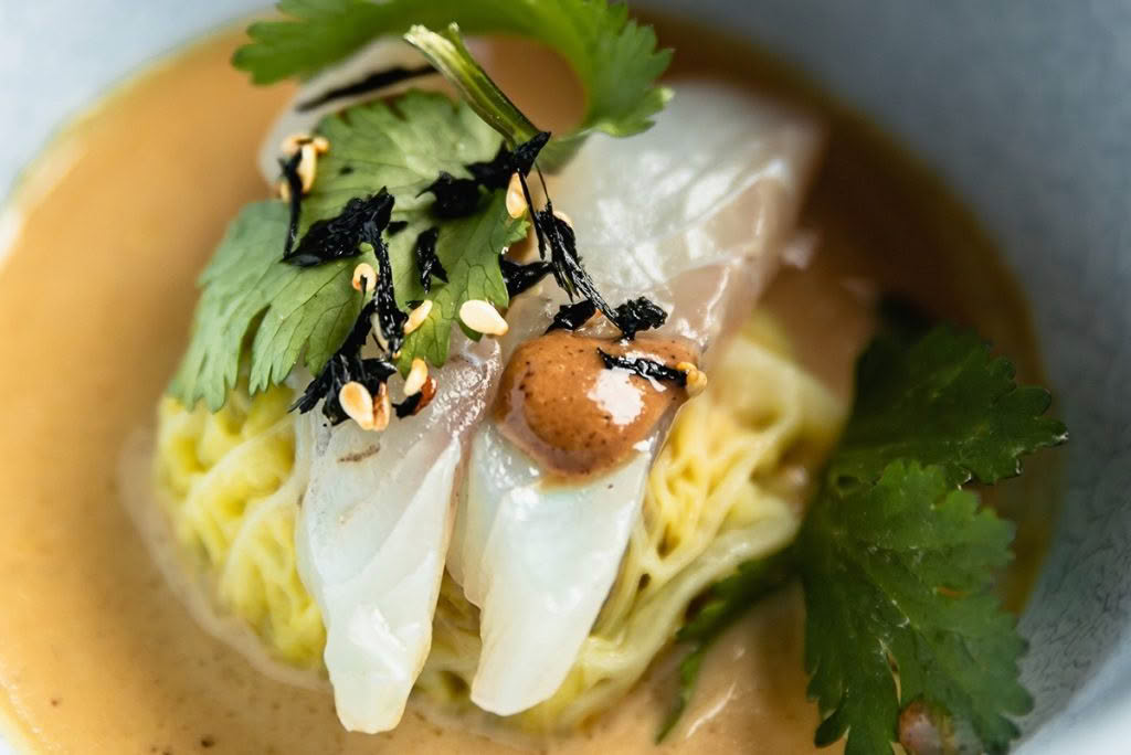 Cuisine-Good-Food-Guide-2024-The-Bistro-Pork-belly-dunpling,-raw-blue-nose,-fermented-black-bean-dressing