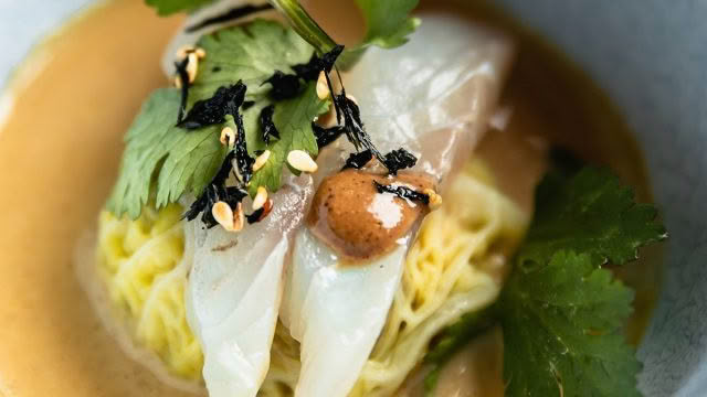 Cuisine-Good-Food-Guide-2024-The-Bistro-Pork-belly-dunpling,-raw-blue-nose,-fermented-black-bean-dressing