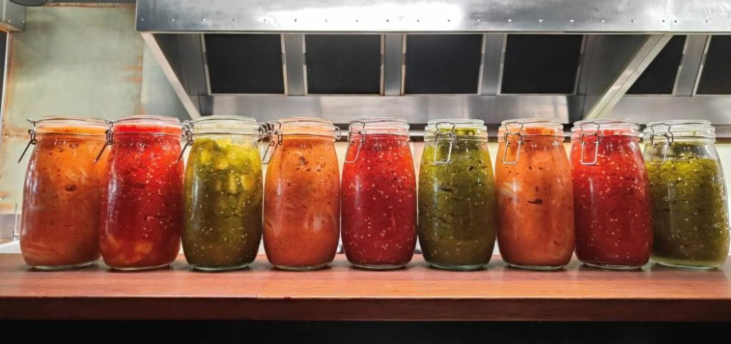 Cuisine Good Food Guide 2025 Hawker House & Bar sauces made from the freshly picked chillies grown by us