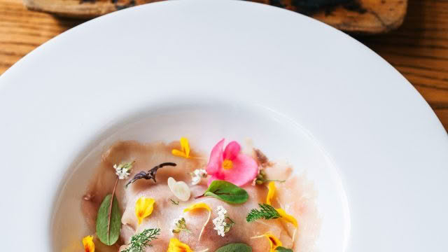 Cuisine Good Food Guide 2026 Aosta Kingfish Carpaccio with flavors of Caprese