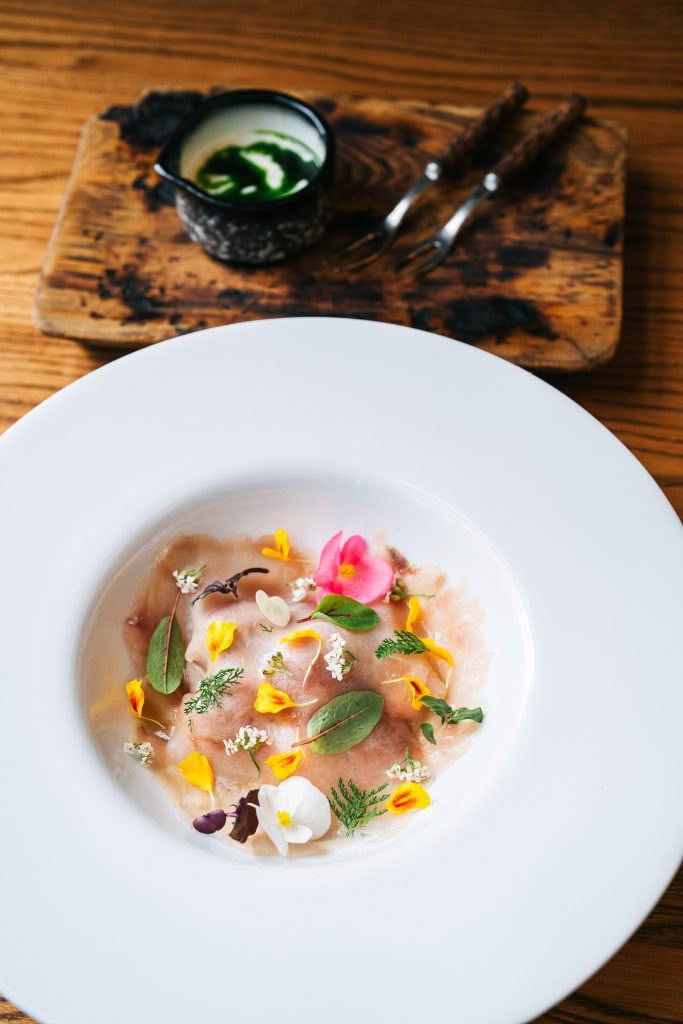 Cuisine Good Food Guide 2026 Aosta Kingfish Carpaccio with flavors of Caprese