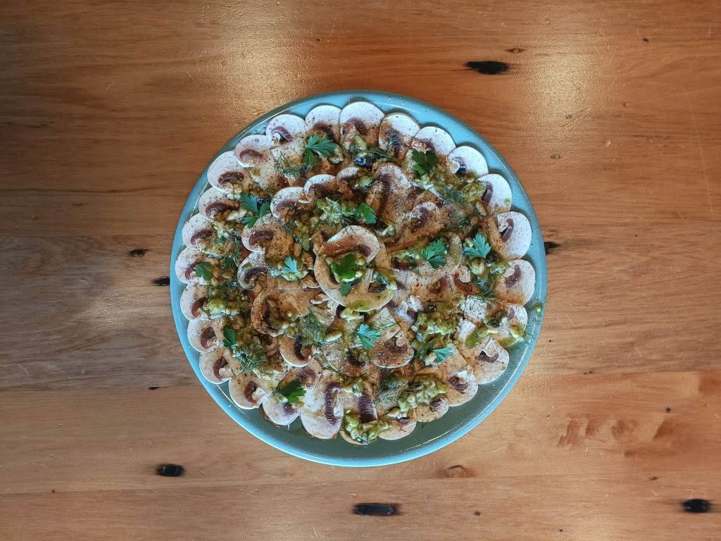 Cuisine Good Food Guide 2026 Graze Mushroom with kawakawa yoghurt topped with porchini powder, pine nuts and a black garlic vinaigrette – Photo credit Stina Persen