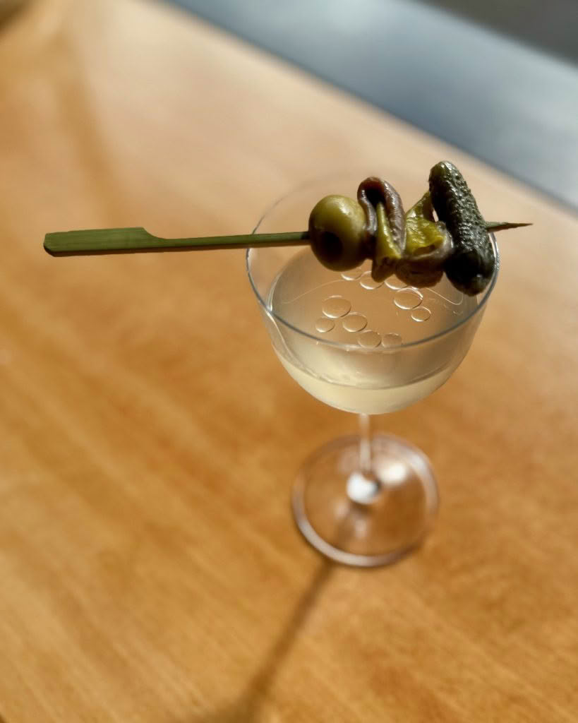 Cuisine Good Food Guide 2026 Margot Martini_ olive oil washed gin, vermouth, olive brine, Ortiz anchovy oil + an Ortiz anchovy gilda
